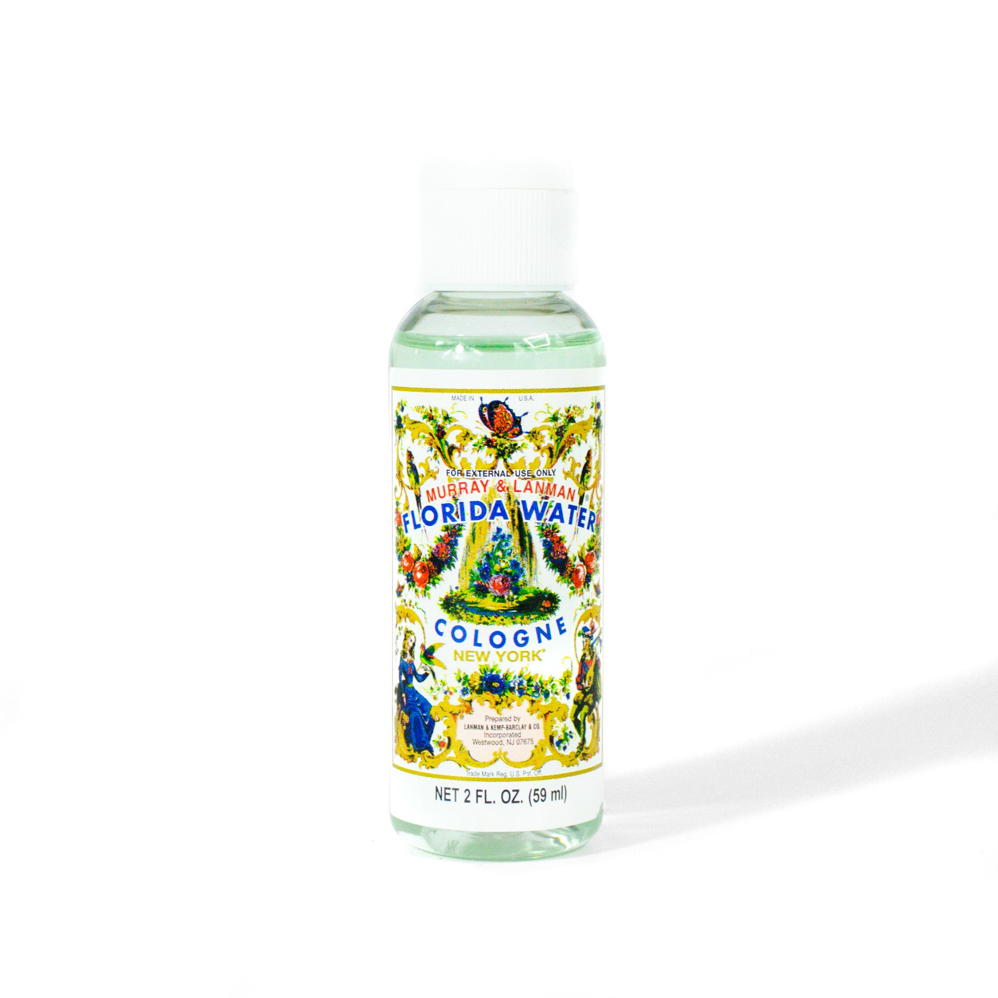 Mini florida water bottle, 2 oz with white cap.