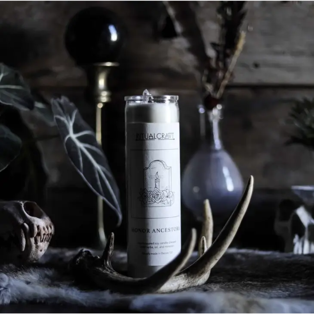 Honor Ancestors ritual jar candle in a witchy dark background with antlers and leaves.
