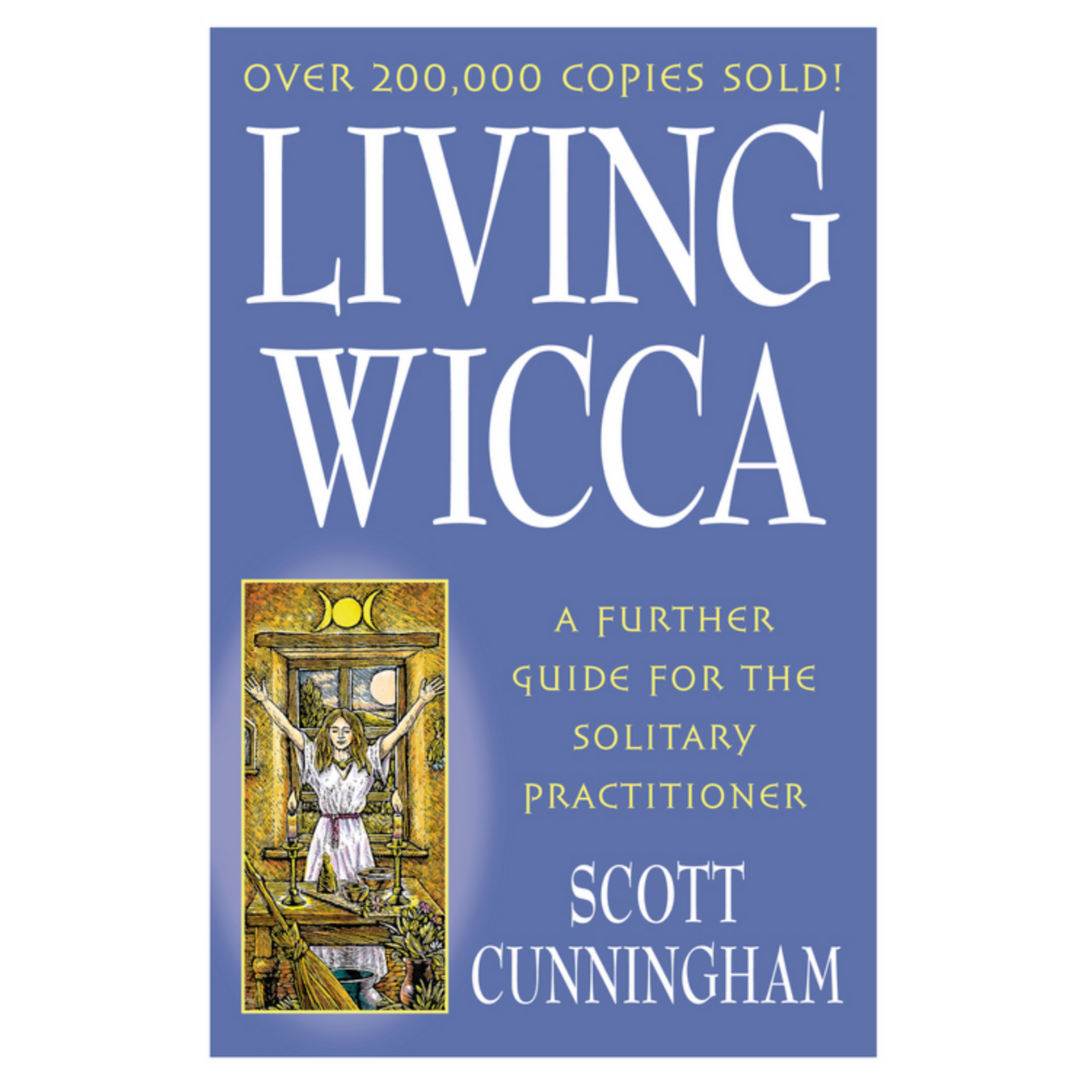 Cover of Living Wicca by Scott Cunningham. Cover is light blue with white text. There is a drawing of a woman with her arms outstretched before her altar. There are two candles lit, a broom, and a triple moon symbol above her.