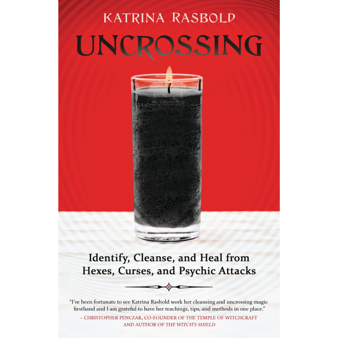 Cover of Uncrossing by Katrina Rasbold is red and shows a lit black glass ritual jar candle. 